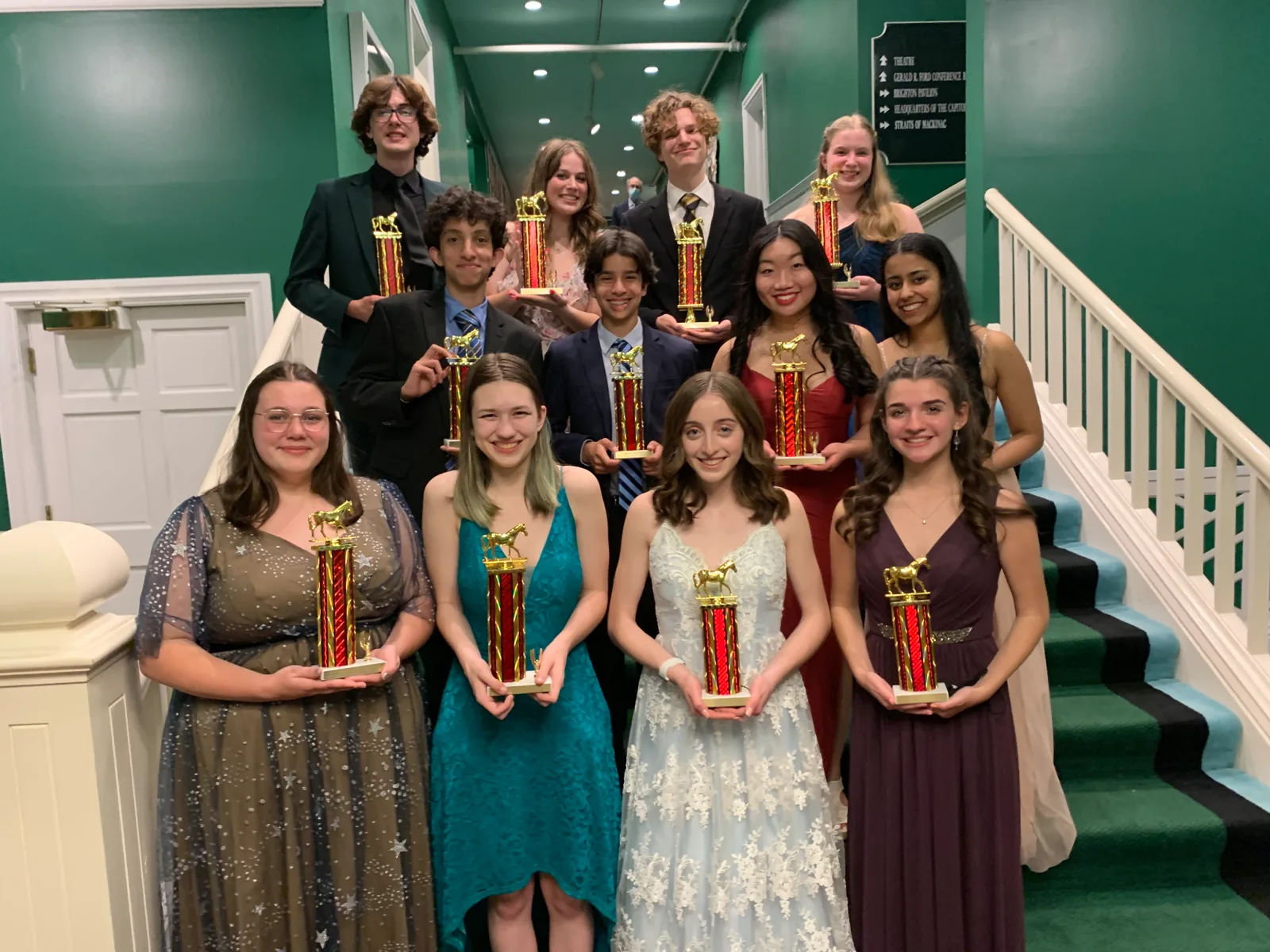 Mackinac 2022 finalists with trophies on the Grand Hotel staircase