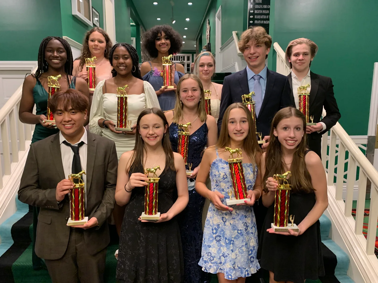 Mackinac 2022 finalists with trophies on the Grand Hotel staircase