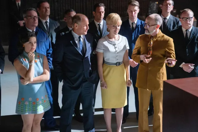 A 1960s-set film scene: Anna Garcia stands with Woody Harrelson, Scarlett Johansson and Jim Rash