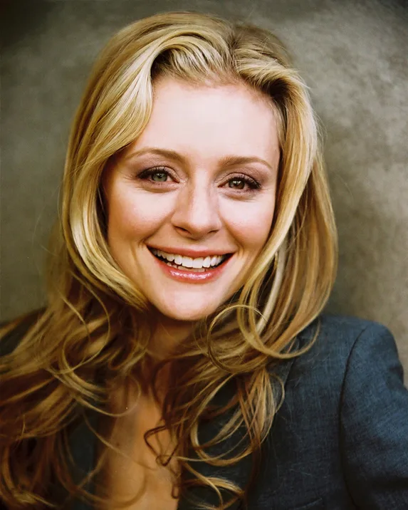 Jessica Cauffiel smiling in a blue blazer