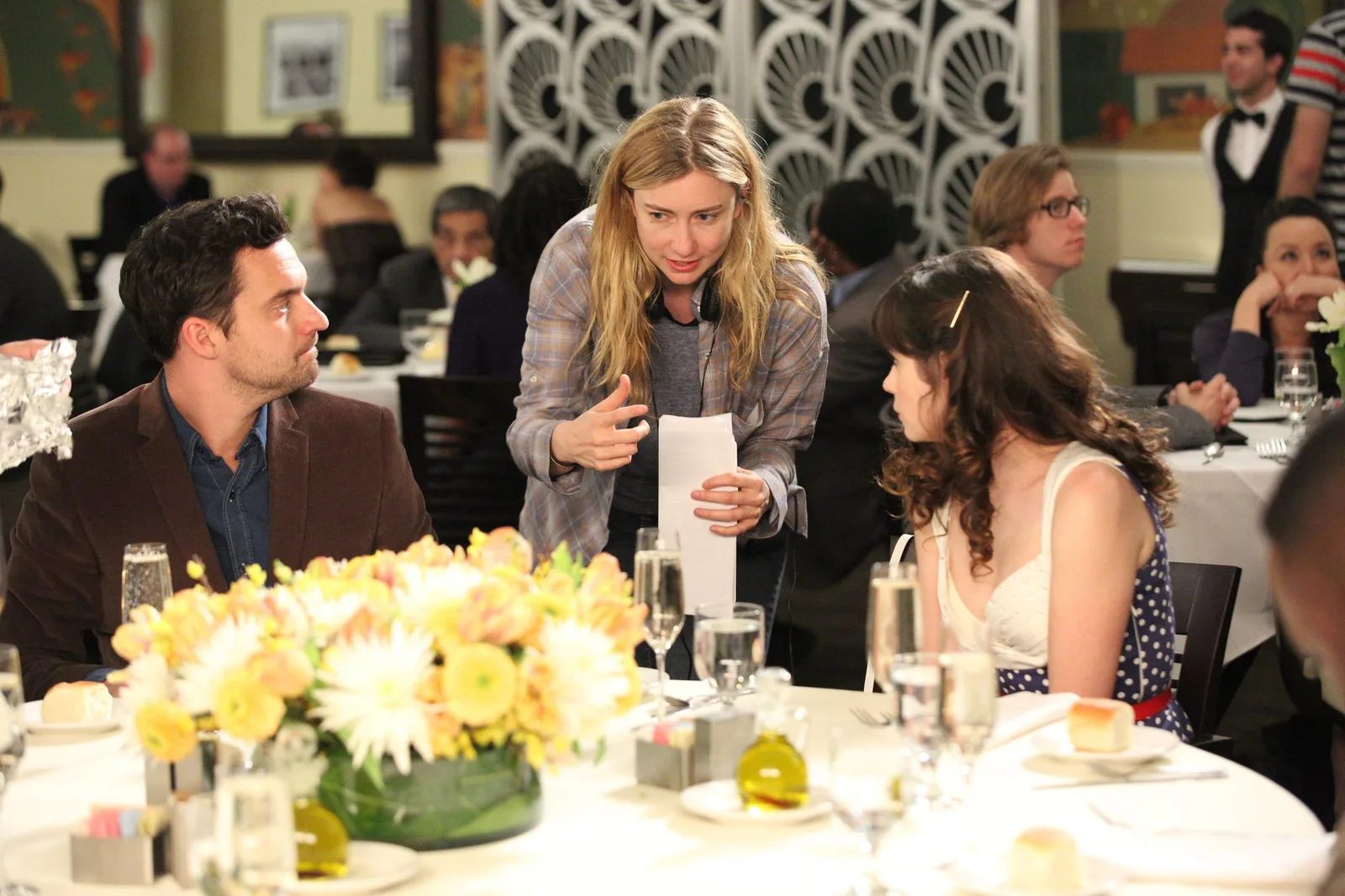Liz Meriwether directing Jake Johnson and Zooey Deschanel on the set of New Girl